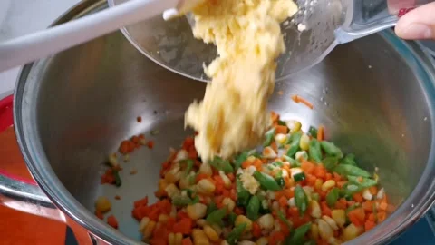 Adding Corn Puree Crushed in a Blender into Mixed Vegetables Stock Footage 236774395