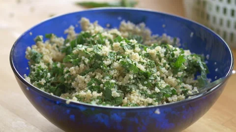 Adding cranberries to a quinoa kale salad Stock Footage 67757624
