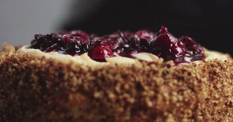 Adding cream and fruit to cake Stock Footage 82993833