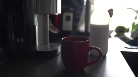 Adding cream in coffee Stock Footage 136455017