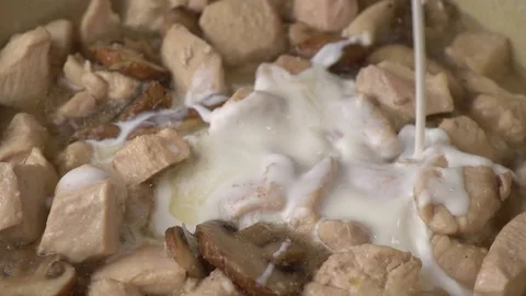 Adding Cream To Pan To Create Sauce Stock Footage 128819813