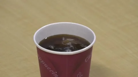 Adding creamer and sugar to coffee Video stock 170336882