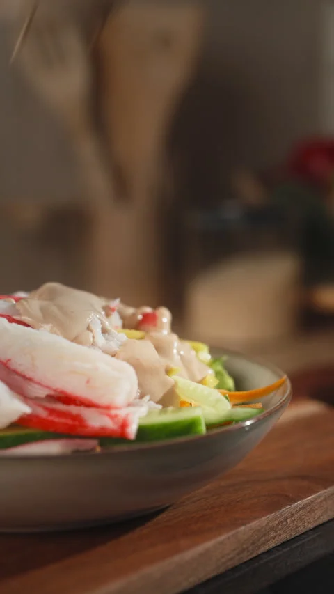 Adding Creamy Dressing to Homemade Crab Stick Salad Vídeo Stock 348796895
