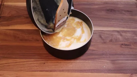 Adding Creamy Roux Mixture to Hot Milk and Whisking Sauce in Slow Motion Stock Footage 334802705