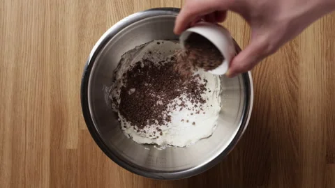 Adding Crushed Chocolate To Ricotta In Bowl Top View Vídeos de archivo 334232498