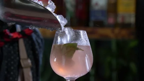 Adding crushed ice into a finished pink drink closeup 4k 60fps Stock Footage 196821520