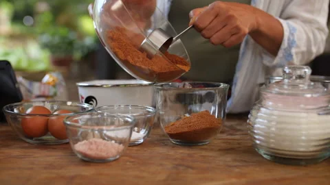 Adding a Cup of Brown Sugar, HD Stock Footage 148191074