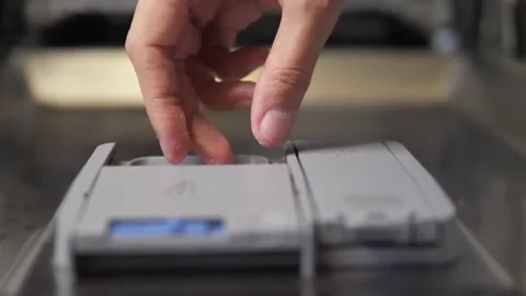 Adding detergent capsule into the dishwasher machine Stock Footage 169769816