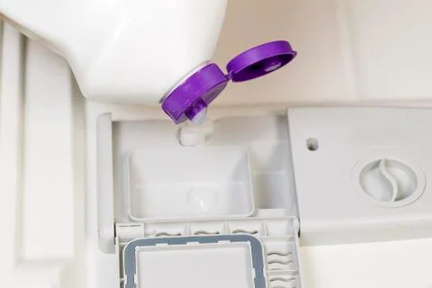 Adding detergent to dishwasher Stock Photos