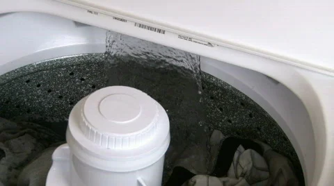 Adding Detergent to Washing Machine Stock Footage 328522