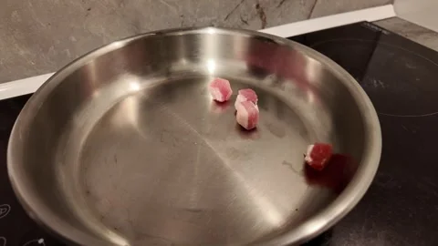 Adding Diced Pork Fat to a Frying Pan Video stock 348108495