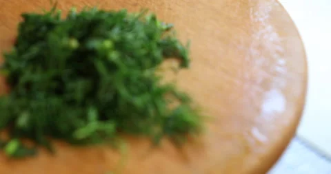 Adding dill to vegetable salad Stock Footage 133828623