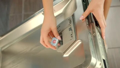 Adding Dishwasher Tablets Detergent.Dishwasher Tablets Dishwasher Machine Stock Footage 150390983