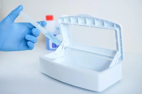Adding disinfectant solution to a sterilizer Stock Photos