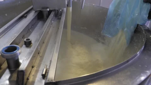 Adding Dry Ingredients To Milk Cream And Stirring In A Large Metal Boiler 스톡 동영상 246800366