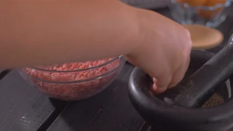 Adding dry spices to the minced meat mince Stock Footage 112177884