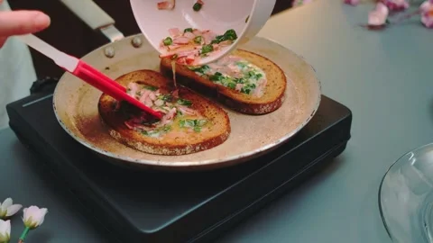 Adding egg filling inside the toast Stock Footage 252186353