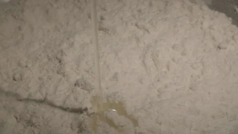 Adding an egg to flour into a bowl in slow motion, cooking course, preparing 스톡 동영상 221425912