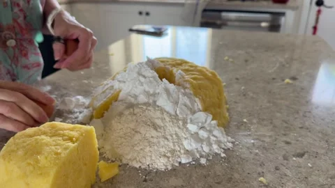 Adding Egg to Potato Dough for Homemade Dumplings Stock Footage 343009551