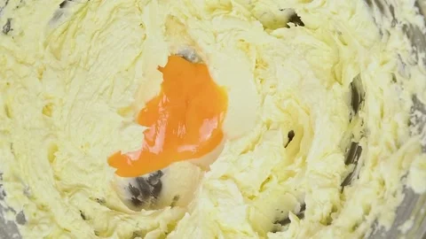 Adding egg yolk to the mixture. Process of making dough. Stock Footage 151195142