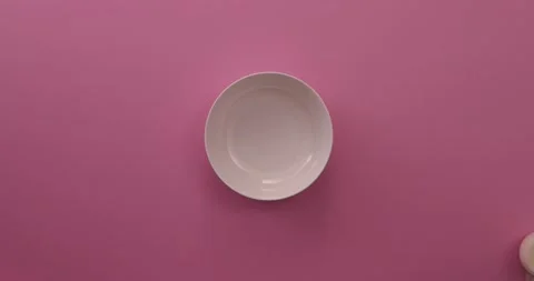 Adding eggs, milk, sugar, vanilla, and cinnamon to a white bowl Stock-Footage 132181331