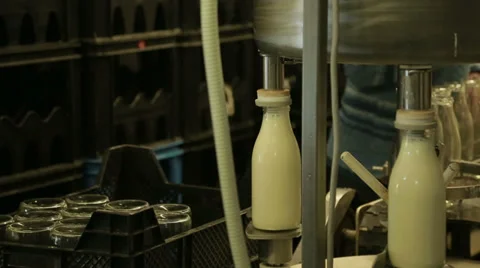 Adding empty bottles to the conveyor Stock Footage 35330891