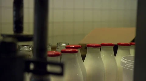 Adding empty bottles to the conveyor [Slomo] Stock Footage 35171109