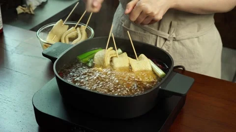 Adding Fish Cake Skewers to Boiling Broth – Korean Street Food Close Up 4K Stock Footage 334160078
