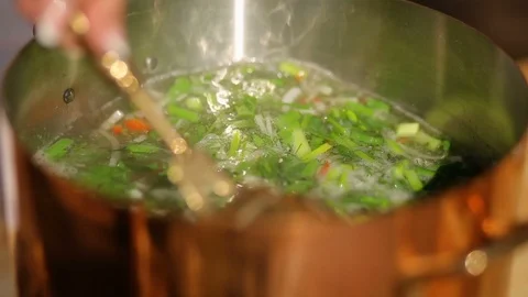 Adding fish to fish soup. Cooking process. close-up Stockbeeldmateriaal 90465389