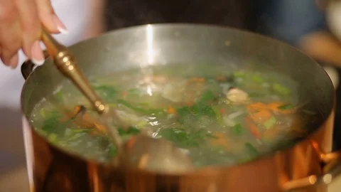 Adding fish to fish soup. Cooking process. close-up Stock Footage 90465613