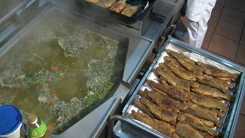 Adding fish to fish soup. Cooking process. close-up  動画素材 90724102