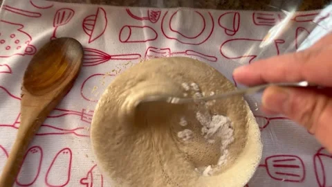 Adding Flour and Stirring Active Yeast Mixture for Bread Baking Stock Footage 344782339