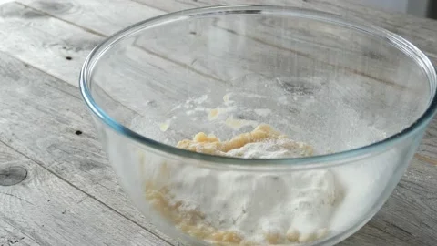 Adding flour to banana puree Stock Footage 176868975