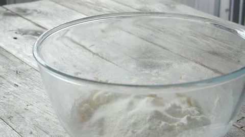 Adding flour to banana puree Stock Footage 176873986