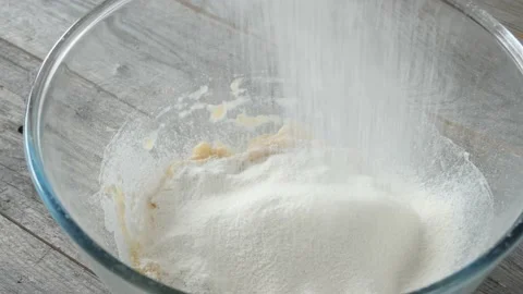 Adding flour to banana puree Stock Footage 176874741