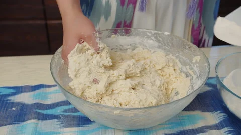 Adding flour into dough mixture Stock Footage 317528360