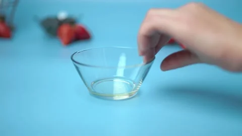 Adding flour, eggs, oil, milk, salt, sugar into a mixing glass bowl. Video stock 133594679