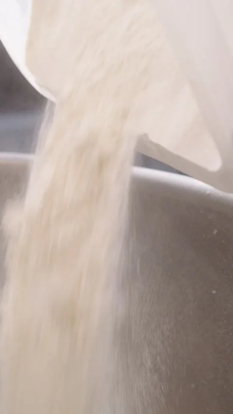 Adding Flour to an Industrial Dough Mixer Stock Footage 345062406