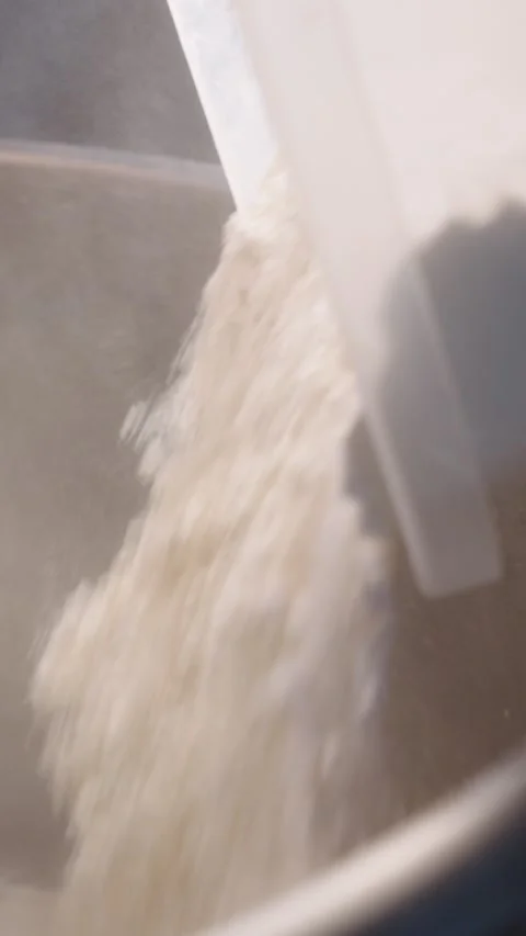 Adding Flour to an Industrial Dough Mixer Slow motion Stock Footage 345252807
