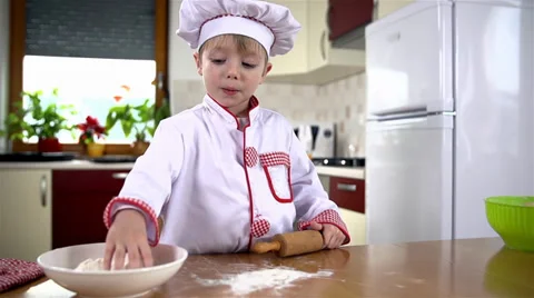 Adding flour on table before rolling dough slow motion Video stock 34433467