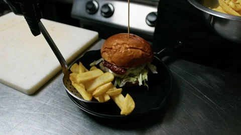 Adding French Fries To Complete The Burger Dish Stock Footage 272985056