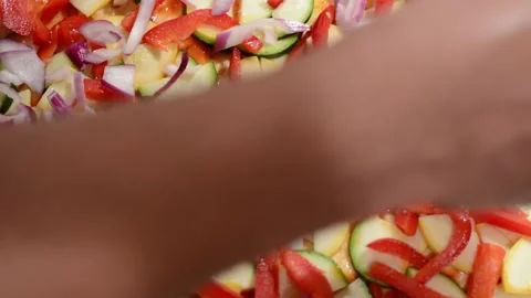 Adding Fresh Cut Red Onions onto Veggie Pizza Stock Footage 130355157