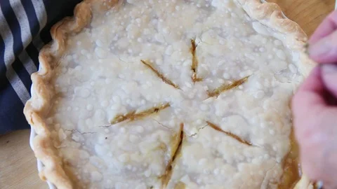 Adding fresh thyme to pot pie Stock Footage 102740926