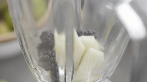 Adding fruit to mixer, blender Stock Footage 140268527