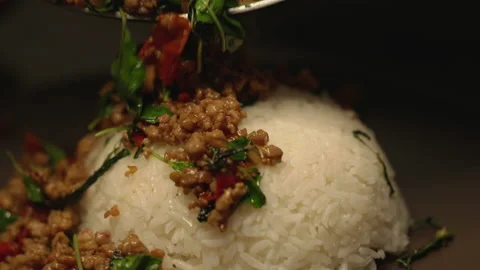 Adding frying minced pork on rice close up shot Stock Footage 150473523