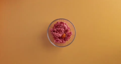 Adding garlic and pepper to the meat Video stock 132204399