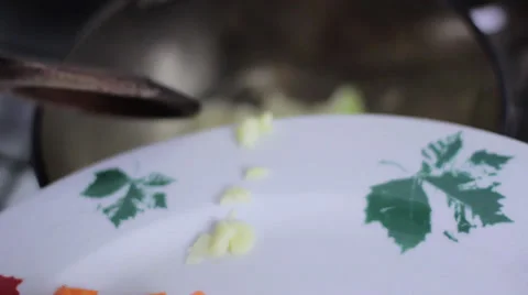 Adding garlic to fried onions Stock Footage 35221462