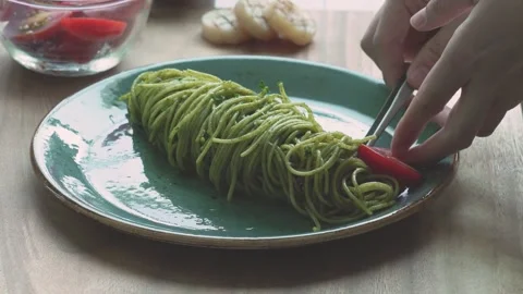 Adding Garnish to Basil Pasta with Tweezers Stock Footage 334172305