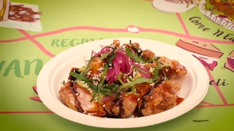 Adding garnish to chicken - Slow Motion Stock Footage 66835150