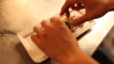 Adding Garnish To Fish Stockbeeldmateriaal 41959927